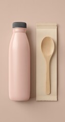 Light pink bottle, wooden spoon, beige napkin