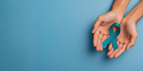 Cupped human hands holding an awareness ribbon on a blue background, symbolizing hope, resilience, prevention, and mental health awareness.
