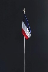National Flag of France Flying Proudly on a Metal Pole Against a Stark Black Background