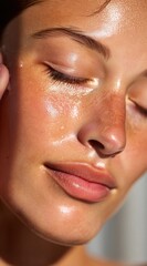 Fototapeta premium Close-Up of a Glowing Face with Radiant Skin and Natural Beauty Highlighted by Sunlight as Light Reflects Off a Glistening Complexion