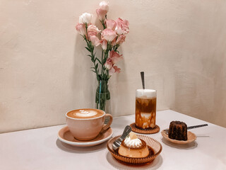 Cozy Café Table with Coffee, Dessert and Flowers