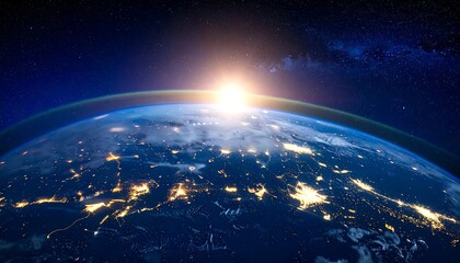 Obraz premium Globe of Earth illuminated by the rising sun, city lights glow on the dark side against a starry sky