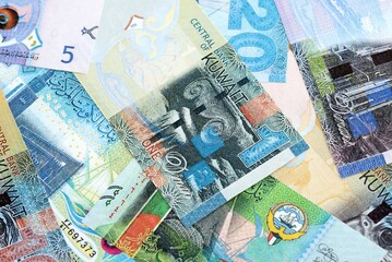 Kuwaiti dinar currency money bills. The current banknotes lies on table in big amount