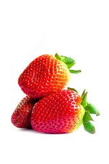 Bright red strawberry placed on a white background.