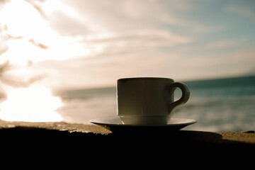 hot cup of coffee on the table in the morning, relaxing time, by the window