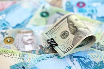 Bahraini dinar currency money bills and bunch of us dollars. The concept of currency exchange