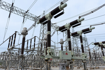 High-voltage power circuit breaker in T-shape configuration at an electric substation. Designed for...