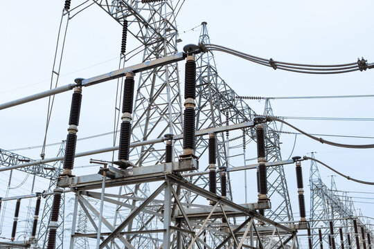 High-voltage disconnecting switch and take-off structure in an electric substation. Designed to isolate and transfer electricity from busbar to transmission towers in power grid systems.