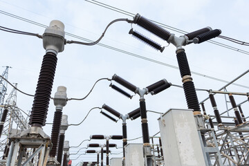 High-voltage Y-type circuit breaker with attached instrument transformers at a power substation....