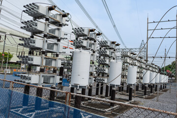 Outdoor high voltage capacitor bank system used to improve power factor and reactive power compensation. Installed in substation for efficient electric power transmission and grid stability.