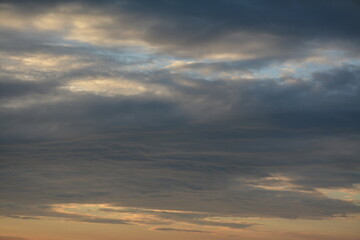 Blue sky in the middle of a cloudy sky