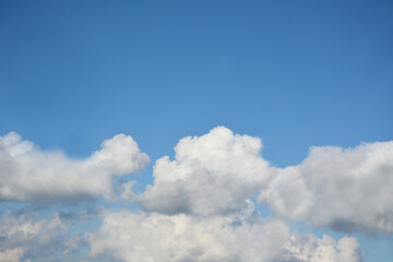 Gray clouds against a blue sky. Background