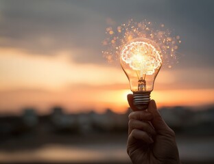 Human brain glowing inside lightbulb symbolizing innovation and bright ideas during sunset.
