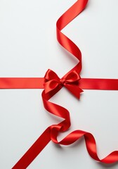 Elegant Red Satin Ribbon with Streamers and Bow on White Background for Gift Wrapping Celebration Decor