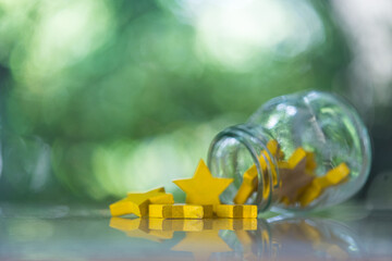 Yellow star from glass. Concept of excellence, yellow star