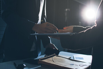 Lawyer explained to the client about the law that must be brought against the court case.