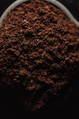 Ground coffee close up, organic roasted coffee powder, aromatic drink ingredient