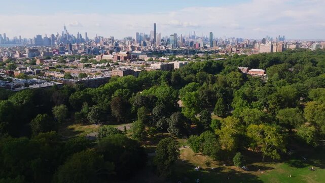 Drone view over Prospect Park, Brooklyn, with the Manhattan skyline in the background on a clear day. Captured in ProRes HQ422