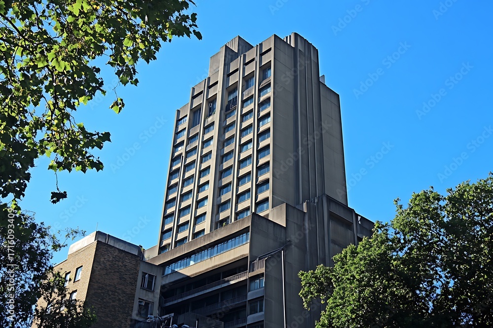 Aufkleber towering brutalist skyscraper with narrow, angular windows and a massive, imposing structure