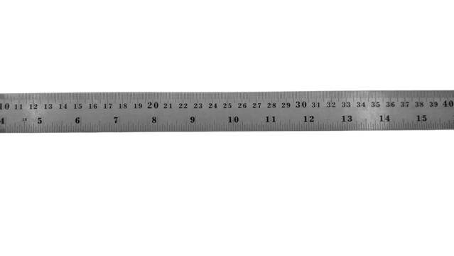 A long stainless steel ruler with dual scales: centimeters and inches. It features a hanging hole at the right end and clear numbers for precise measurements.