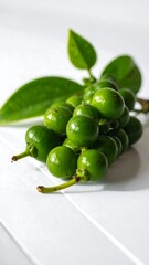 Fresh green berries on white wood