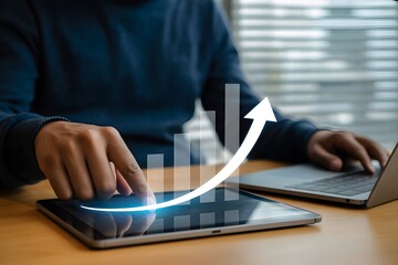 Businessman analyzing sales growth on tablet showing progress and success