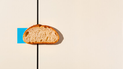 Bread slice rests elegantly on a minimalist tabletop