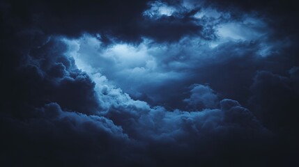 Dramatic storm clouds in deep blue, a sweeping skyscape with dynamic light, nature's raw power on display
