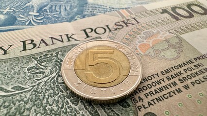 5 Polish Zloty Coin on Banknotes – Currency and Finance Concept