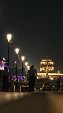 A close night view of Rashtrapati Bhavan beautifully illuminated with decorative lighting, seen from Kartavya Path