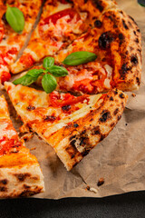 Pizza tomato margarita fast food natural product tasty snack fresh delicious gourmet food background on the table rustic top view copy space