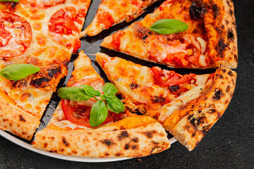 Pizza tomato margarita fast food natural product tasty snack fresh delicious gourmet food background on the table rustic top view copy space