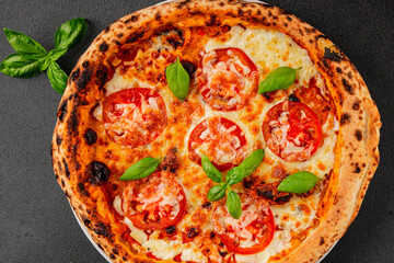 Pizza tomato margarita fast food natural product tasty snack fresh delicious gourmet food background on the table rustic top view copy space
