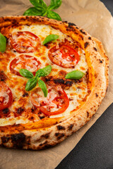 Pizza tomato margarita fast food natural product tasty snack fresh delicious gourmet food background on the table rustic top view copy space