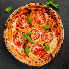 Pizza tomato margarita fast food natural product tasty snack fresh delicious gourmet food background on the table rustic top view copy space
