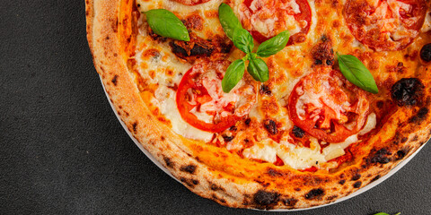 Pizza tomato margarita fast food natural product tasty snack fresh delicious gourmet food background on the table rustic top view copy space