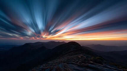 Mountains with blurred sky at sunset.