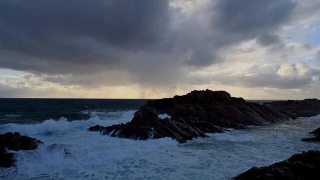 waves of the rough sea in the indian ocean splashing around Canal Rocks at the rocky coastline of Yellingup, Margaret River Region in Western Australia with dramatic sky.