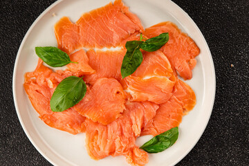 Smoked salmon fish seafood portion size natural product tasty snack fresh delicious gourmet food background on the table rustic top view copy space pescetarian diet