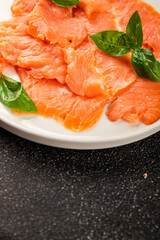 Smoked salmon fish seafood portion size natural product tasty snack fresh delicious gourmet food background on the table rustic top view copy space pescetarian diet