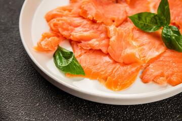 Smoked salmon fish seafood portion size natural product tasty snack fresh delicious gourmet food background on the table rustic top view copy space pescetarian diet