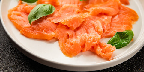 Smoked salmon fish seafood portion size natural product tasty snack fresh delicious gourmet food background on the table rustic top view copy space pescetarian diet