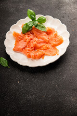 Smoked salmon fish seafood portion size natural product tasty snack fresh delicious gourmet food background on the table rustic top view copy space pescetarian diet