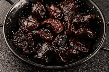 Prunes smoked plum portion size natural product tasty snack fresh delicious gourmet food background on the table rustic top view copy space keto and paleo diet vegetarian and vegan food