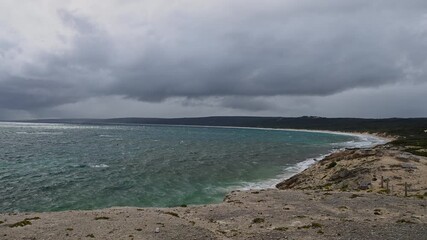 rocky coastline and sand beaches of beautiful Hamelin Bay, where Stingrays can be seen in the shallow water, a popular travel destination in Western Australia on a stormy bad weather day..