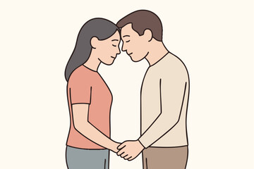 Couple holding hands forehead touch