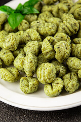 Gnocchi spinach potato dough second course portion size natural product tasty snack fresh delicious gourmet food background on the table rustic top view copy space