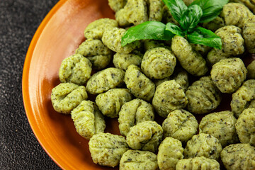 Gnocchi spinach potato dough second course portion size natural product tasty snack fresh delicious gourmet food background on the table rustic top view copy space