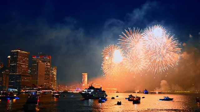 Fantastic firework in the dark sky over the East River. Beautiful celebration in New York at night.