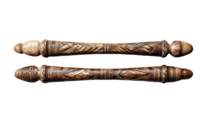 Pair of carved wooden or bone rods with intricate patterns